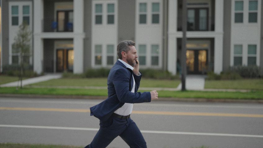 man running on a phone call