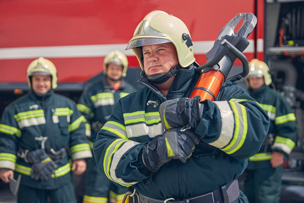 Responder Connect fireman holding heavy equipment